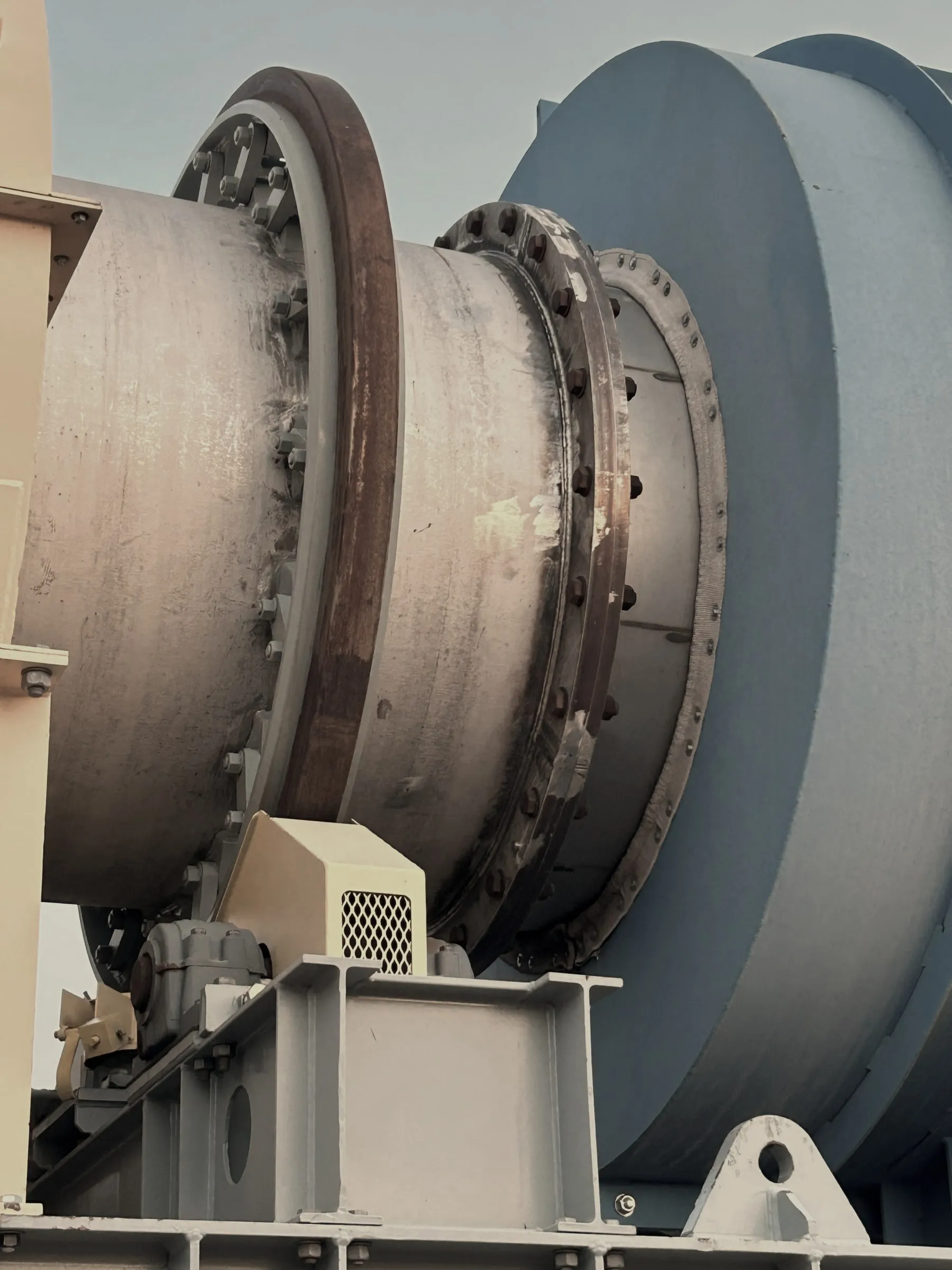 A large rotary kiln drum on its steel support frame at the Wyoming Innovation Center.
